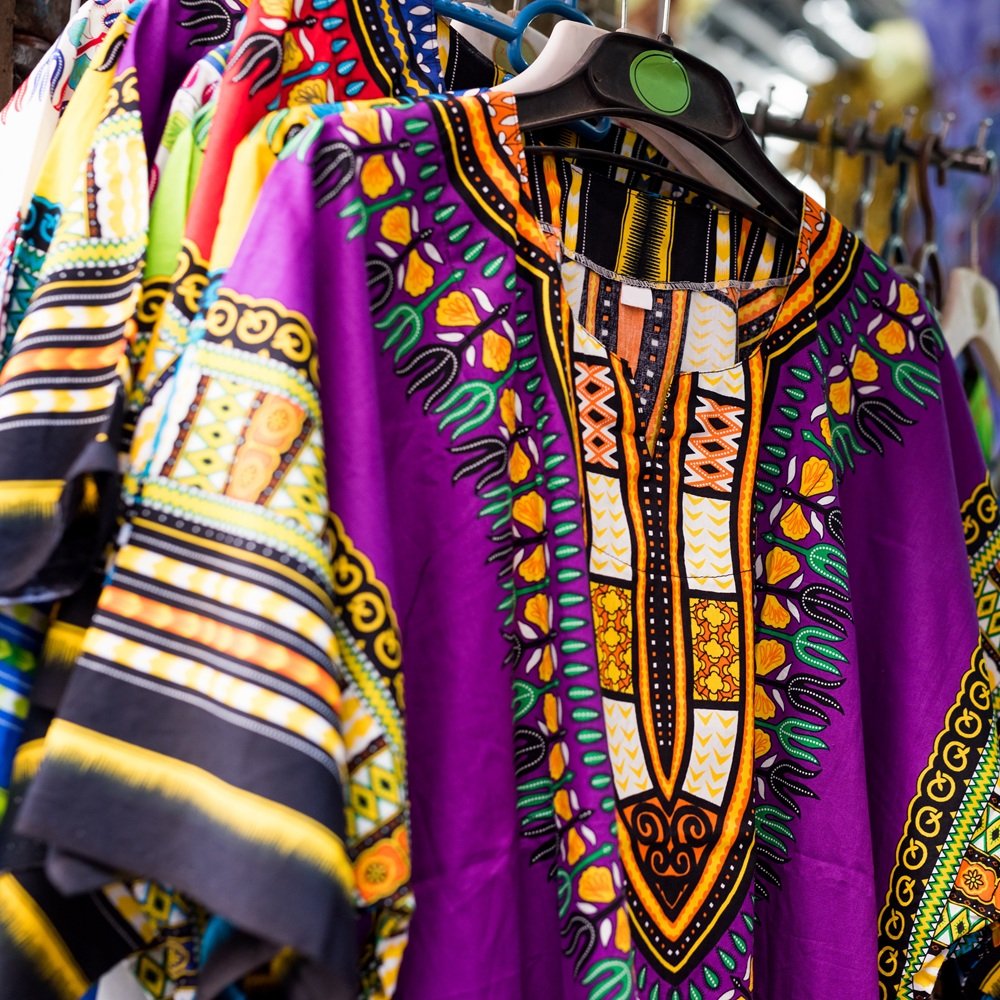 beautiful colorful traditional clothes with patterns at african market